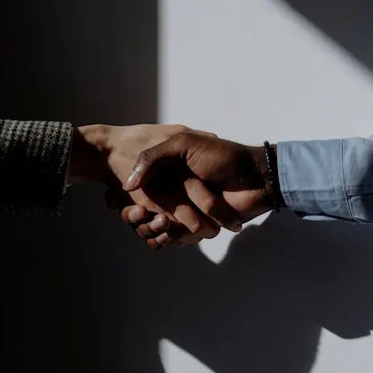 Closeup of two professionals shaking hands